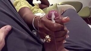 Desi woman gives young man handjob on train